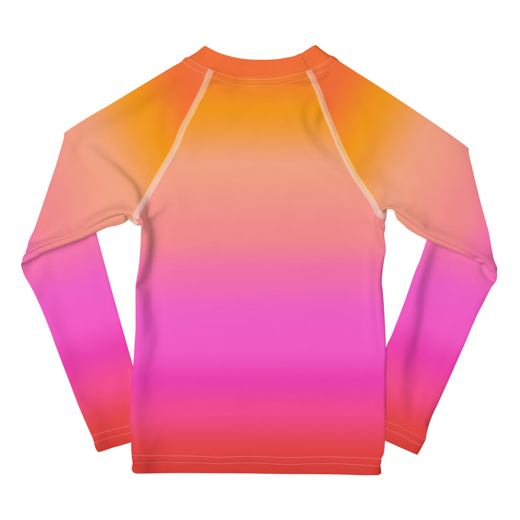 Girls sunset ombre long sleeve rash guard swim shirt with upf 50 plus features a vibrant orange to pink gradient and white seams