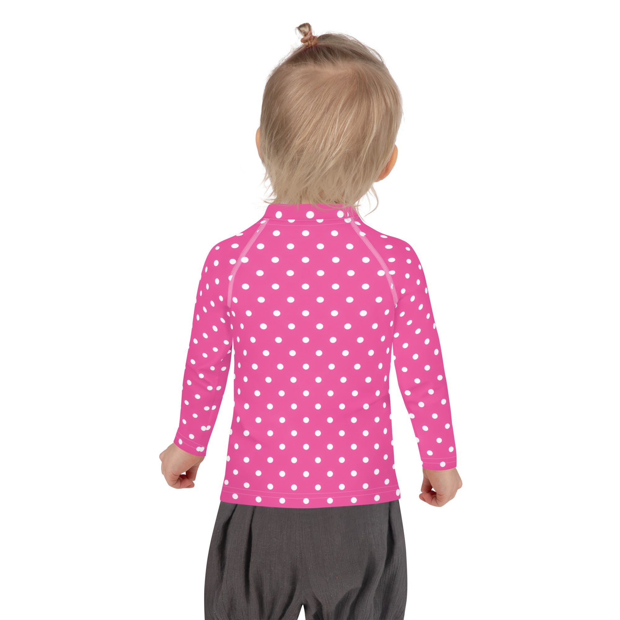Girls pink long sleeve rash guard swim shirt with white polka dots and UPF 50 plus sun protection