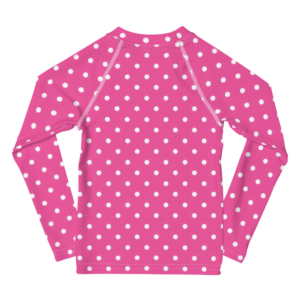 Girls pink long sleeve rash guard swim shirt with white polka dots and UPF 50 plus for sun protection