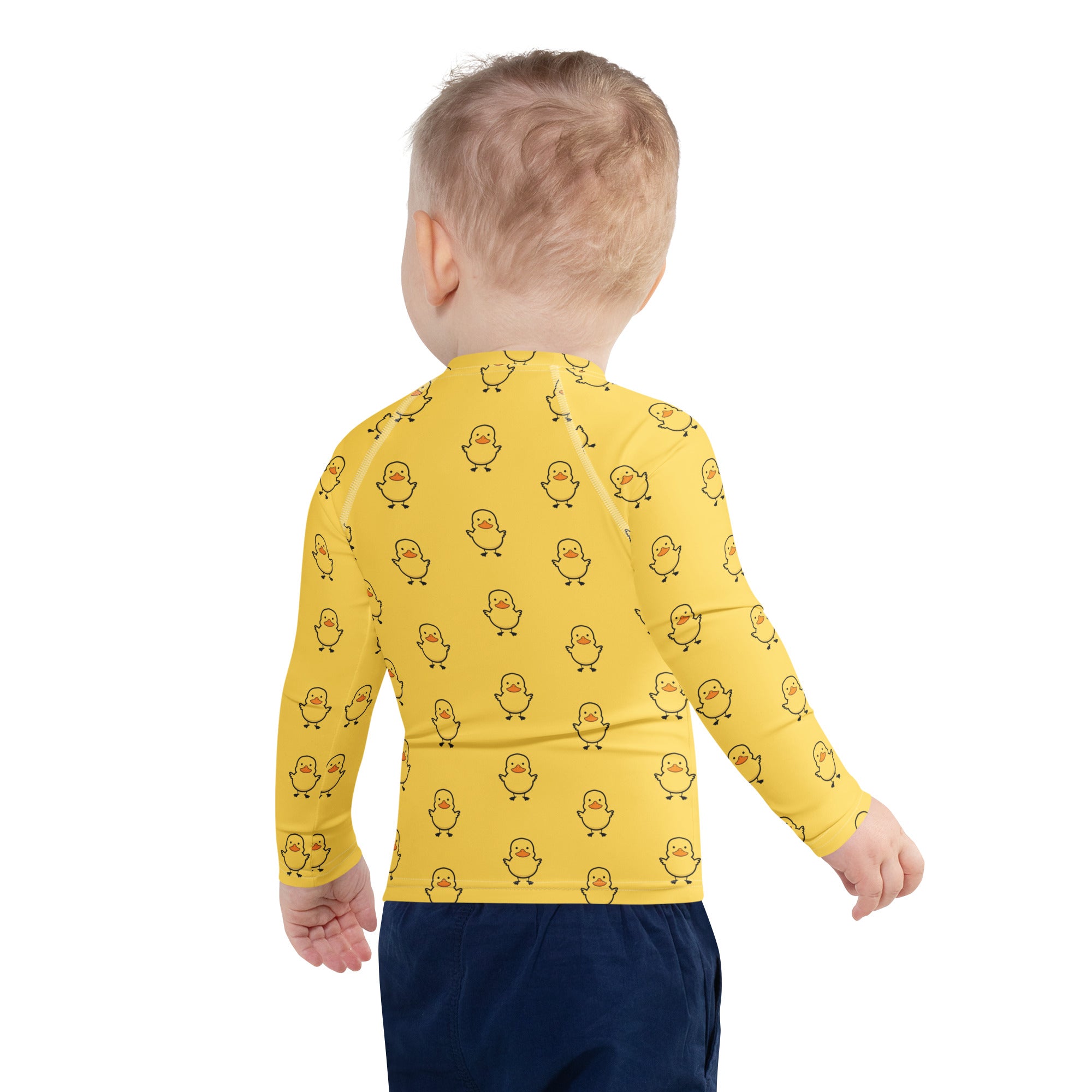 Yellow long sleeve rash guard swim shirt with black outlined duck pattern and upf 50 plus for sun protection