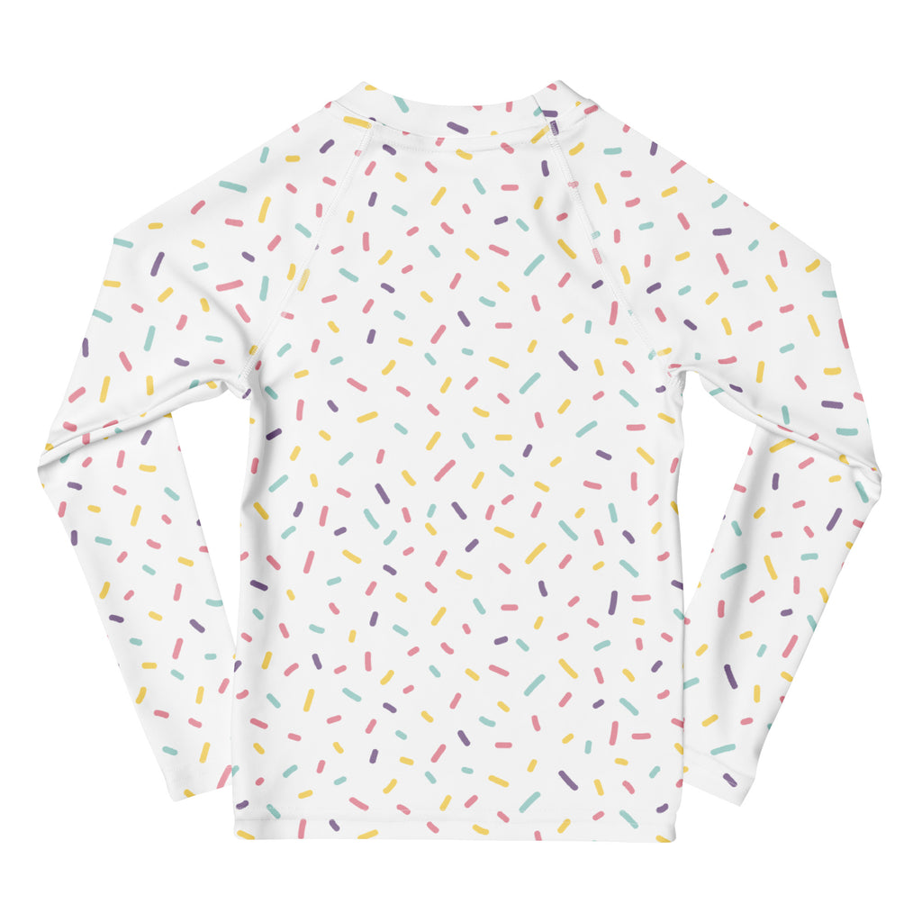 White long sleeve rash guard swim shirt with colorful pastel sprinkles and UPF 50 plus sun protection for kids