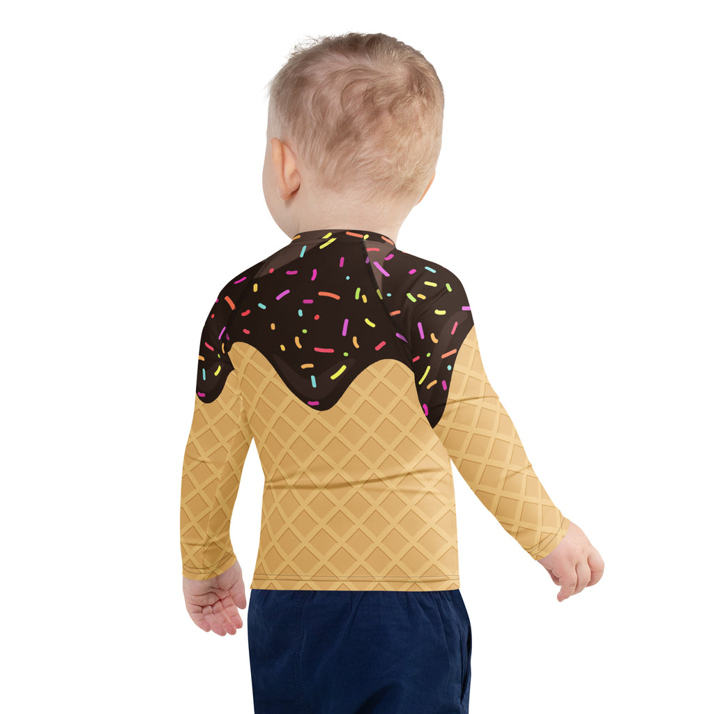 A child wearing the back of a yellow birthday boy chocolate ice cream cone long sleeve rash guard with upf 50 plus