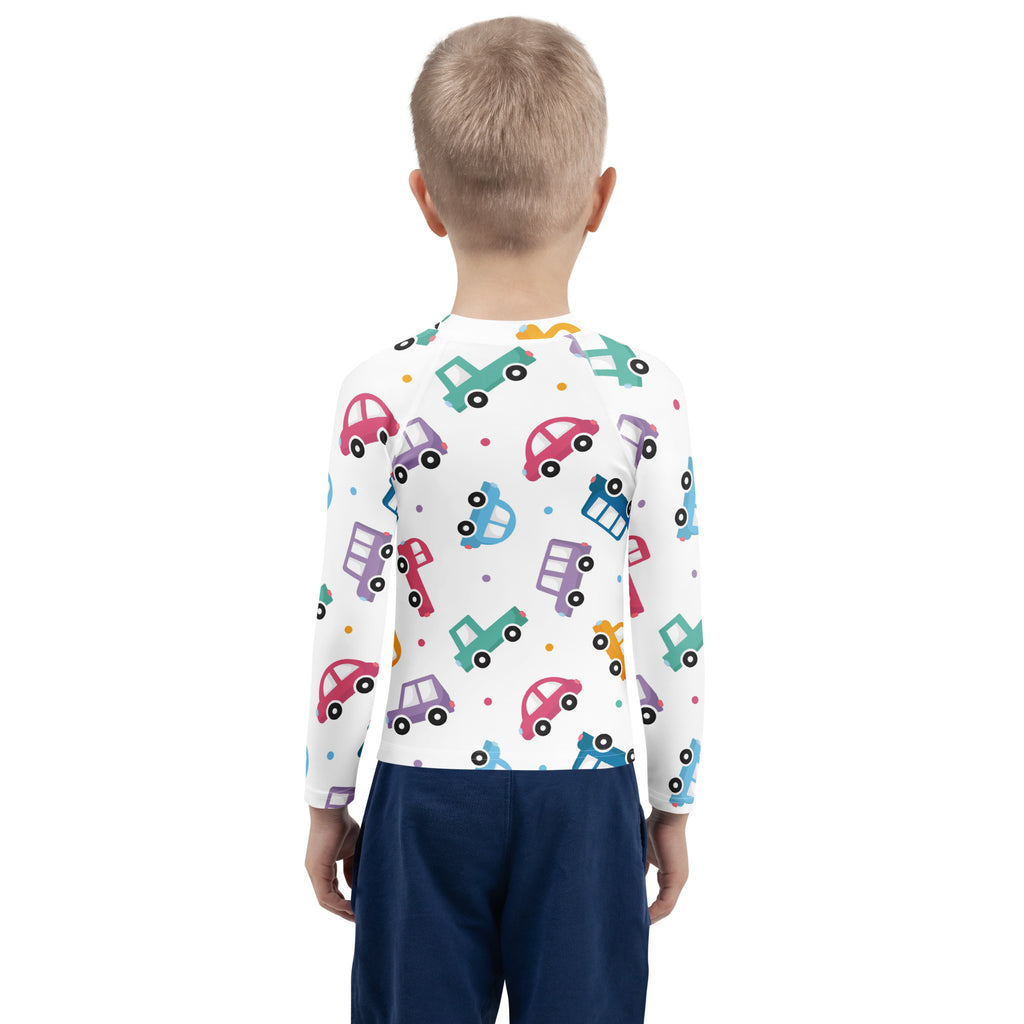 White long-sleeved kids rash guard with colorful cartoon cars pattern and upf 50+ for sun protection