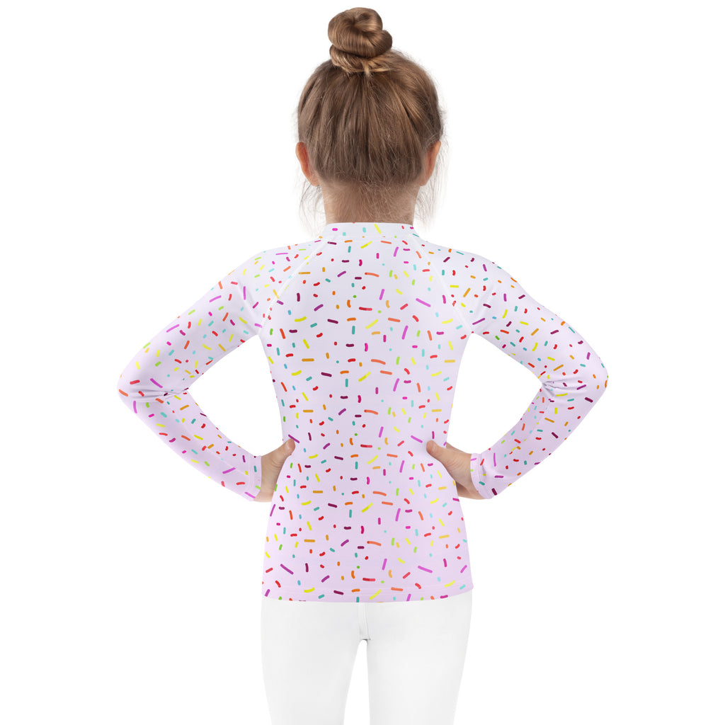 Pink long sleeve rash guard swim shirt with colorful sprinkle pattern and upf 50 plus for birthday girls