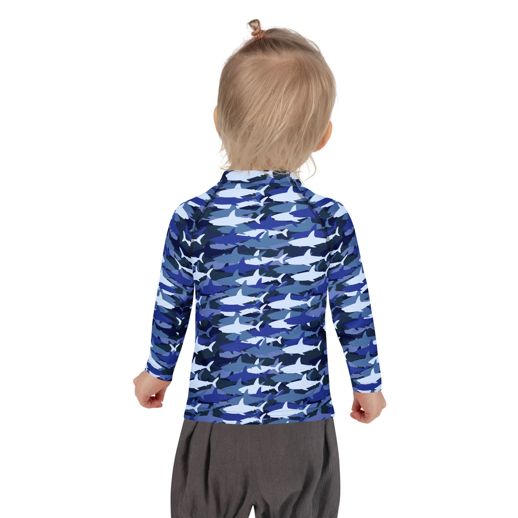Kids blue and white shark-patterned long sleeve rash guard swim shirt with UPF 50 plus for sun protection