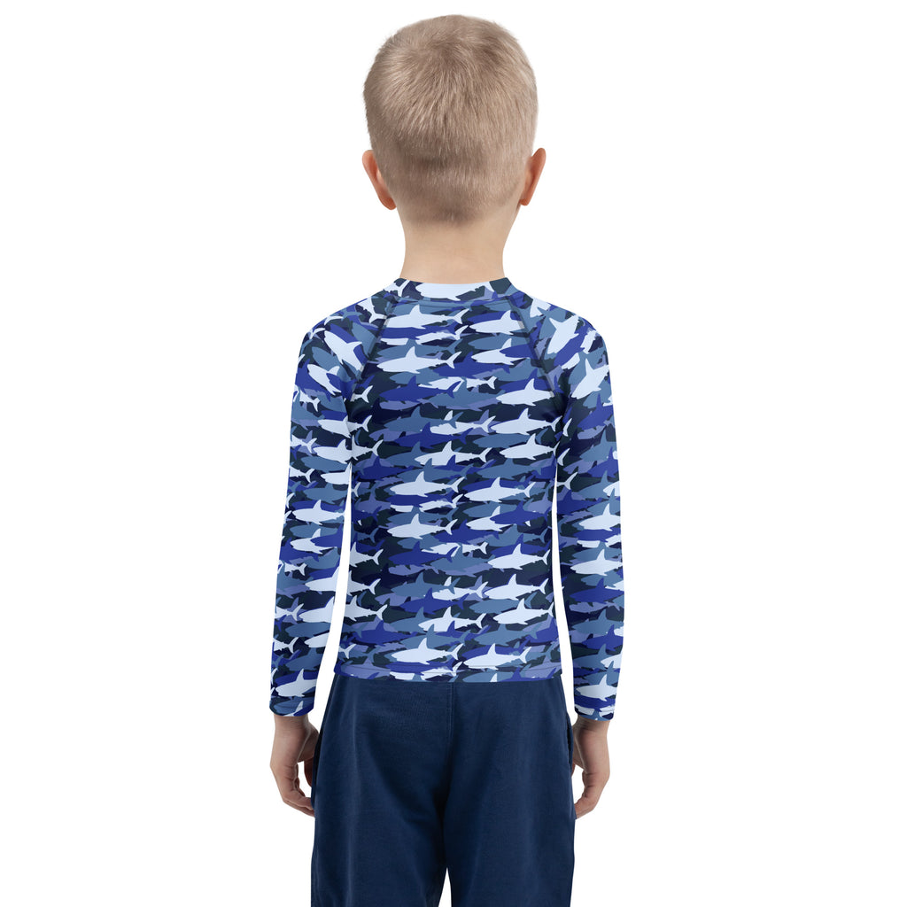 Kids blue and white shark-patterned long sleeve rash guard swim shirt with UPF 50 plus for sun protection