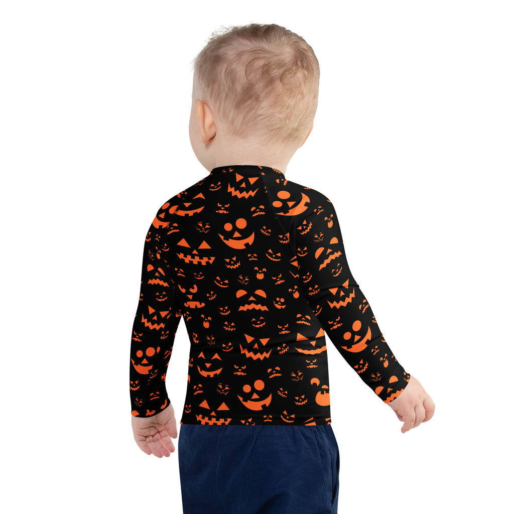 Kids orange jack o lantern faces halloween long sleeve rash guard swim shirt with upf 50 plus in black and orange