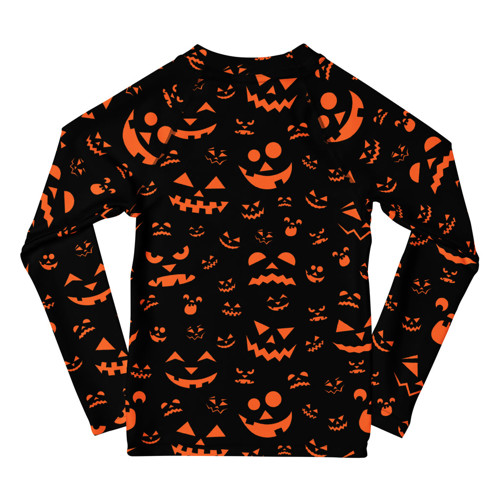 Kids orange jack-o-lantern faces halloween long sleeve rash guard swim shirt with vibrant pumpkin pattern and upf 50+