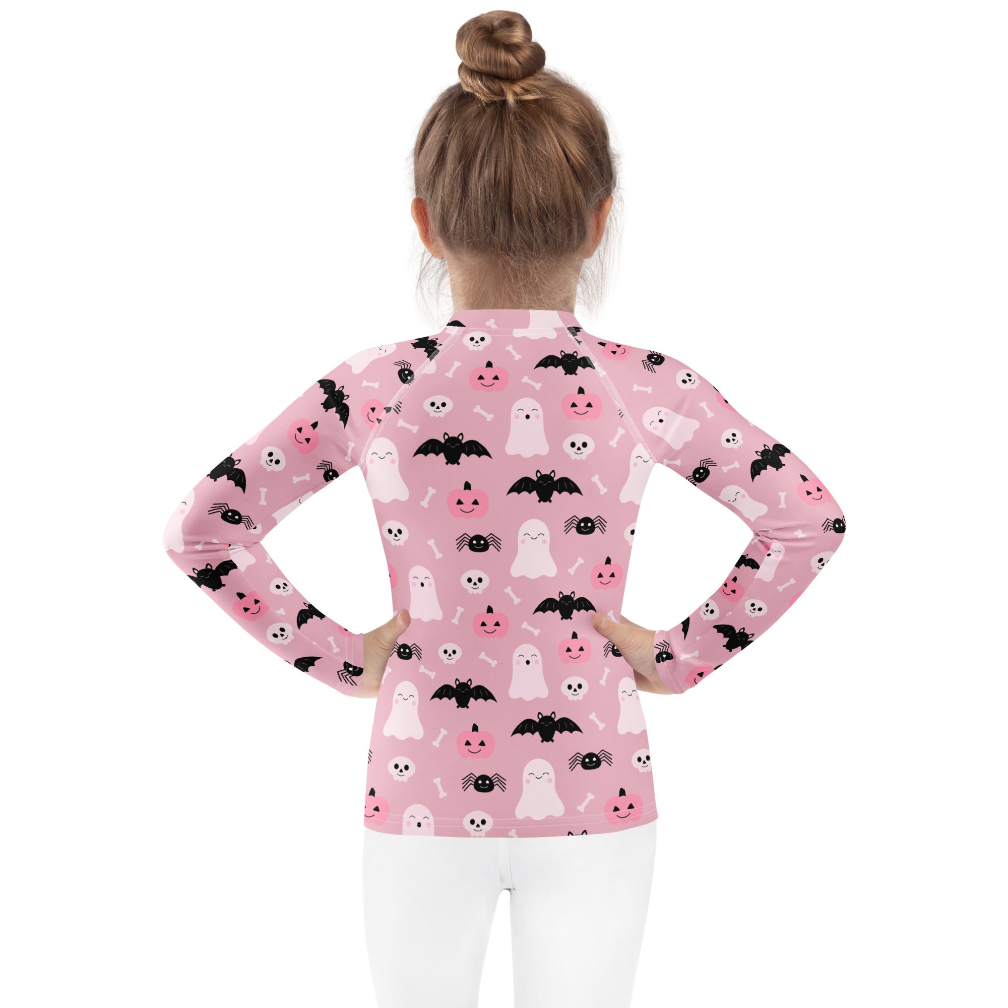 Girls pink long sleeve halloween rash guard swim shirt with smiling pumpkins bats ghosts print and UPF 50 plus protection