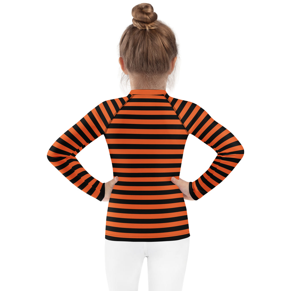 Kids orange and black halloween long sleeve rash guard swim shirt with high collar and raglan sleeves with upf 50+