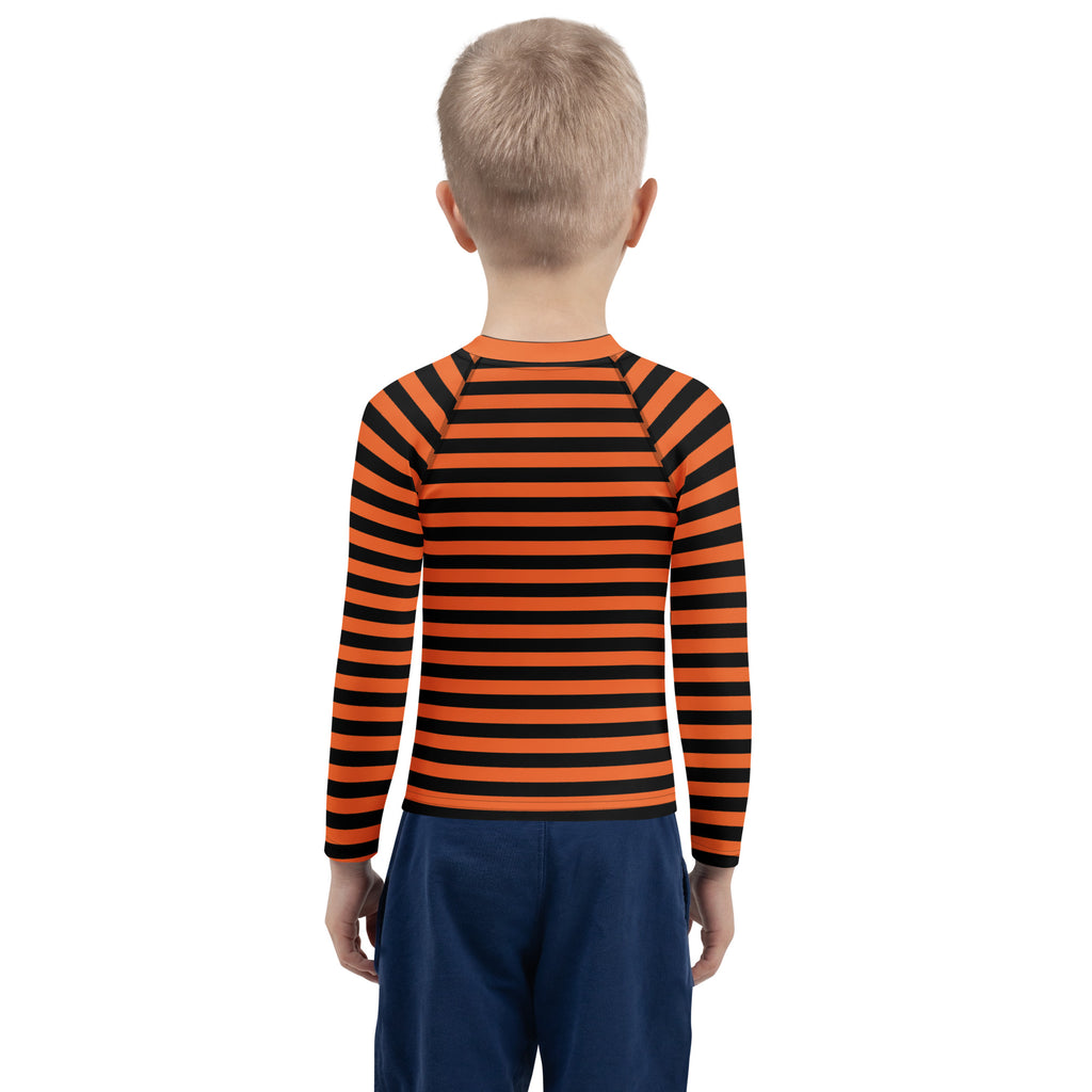 Kids orange and black Halloween long sleeve rash guard swim shirt with UPF 50 plus featuring horizontal stripes