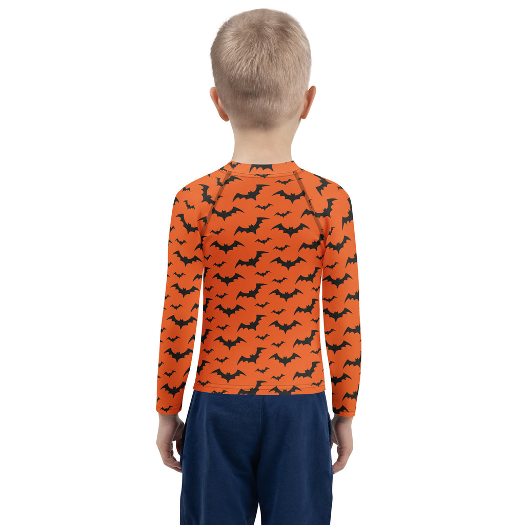 Kids orange long sleeve rash guard with black bat pattern designed for Halloween swimwear with upf 50 plus protection