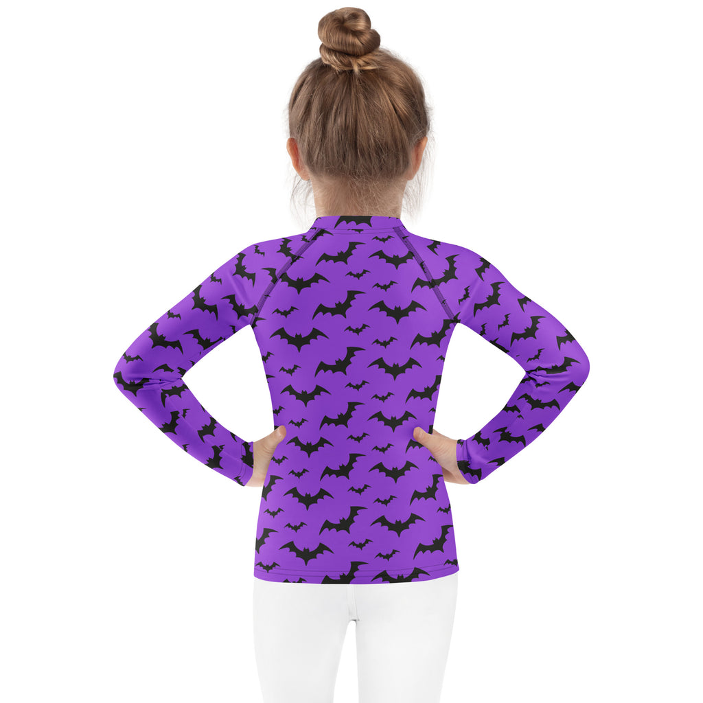 Kids purple long-sleeve rash guard swim shirt with black bat pattern and upf 50+ for halloween protection