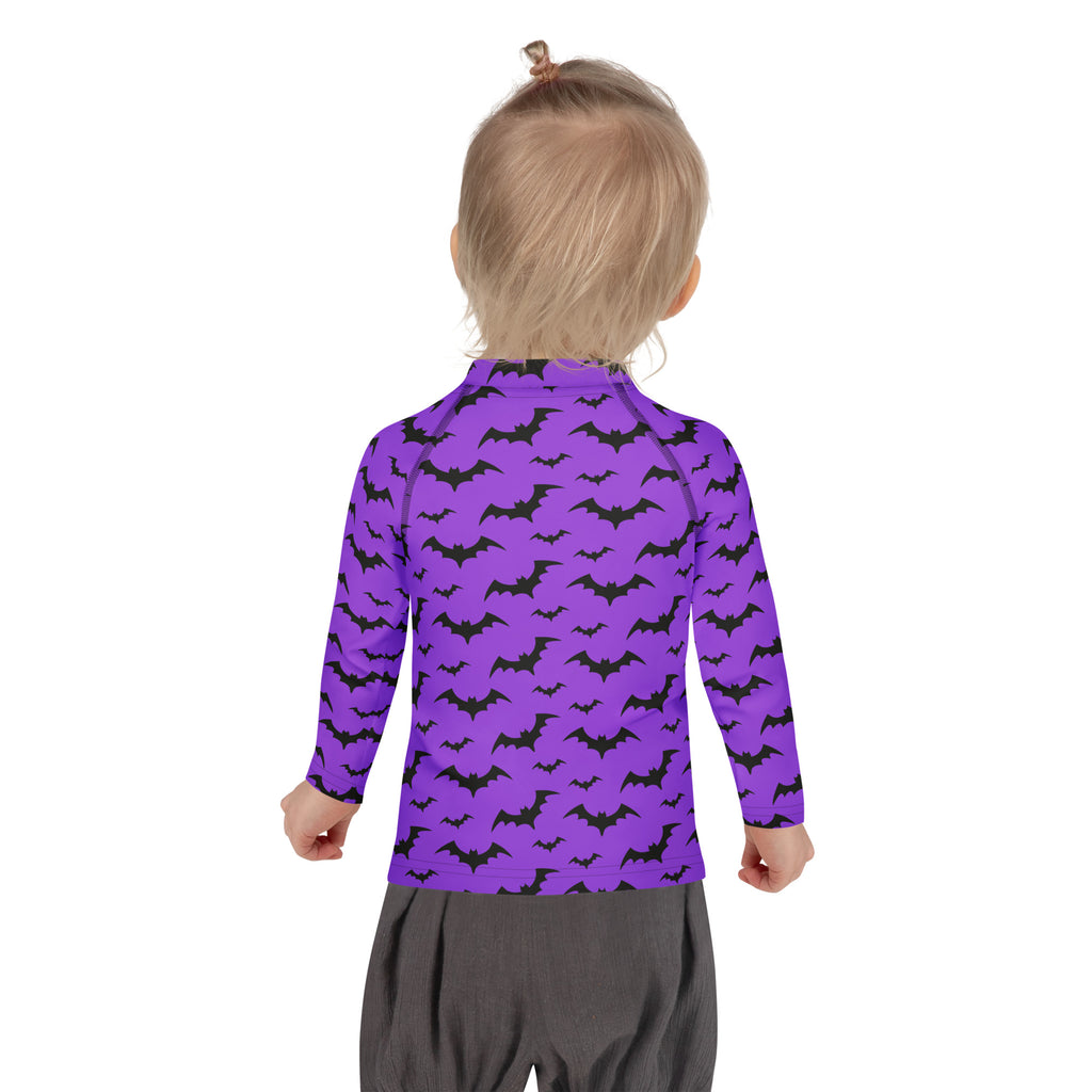 Kids purple long sleeve rash guard swim shirt with black bat patterns and upf 50 plus for halloween protection