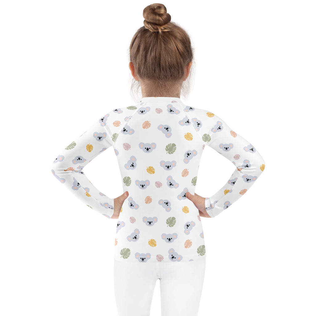 Kids koala bear long sleeve rash guard swim shirt in white with gray koalas and multicolored tropical leaves pattern