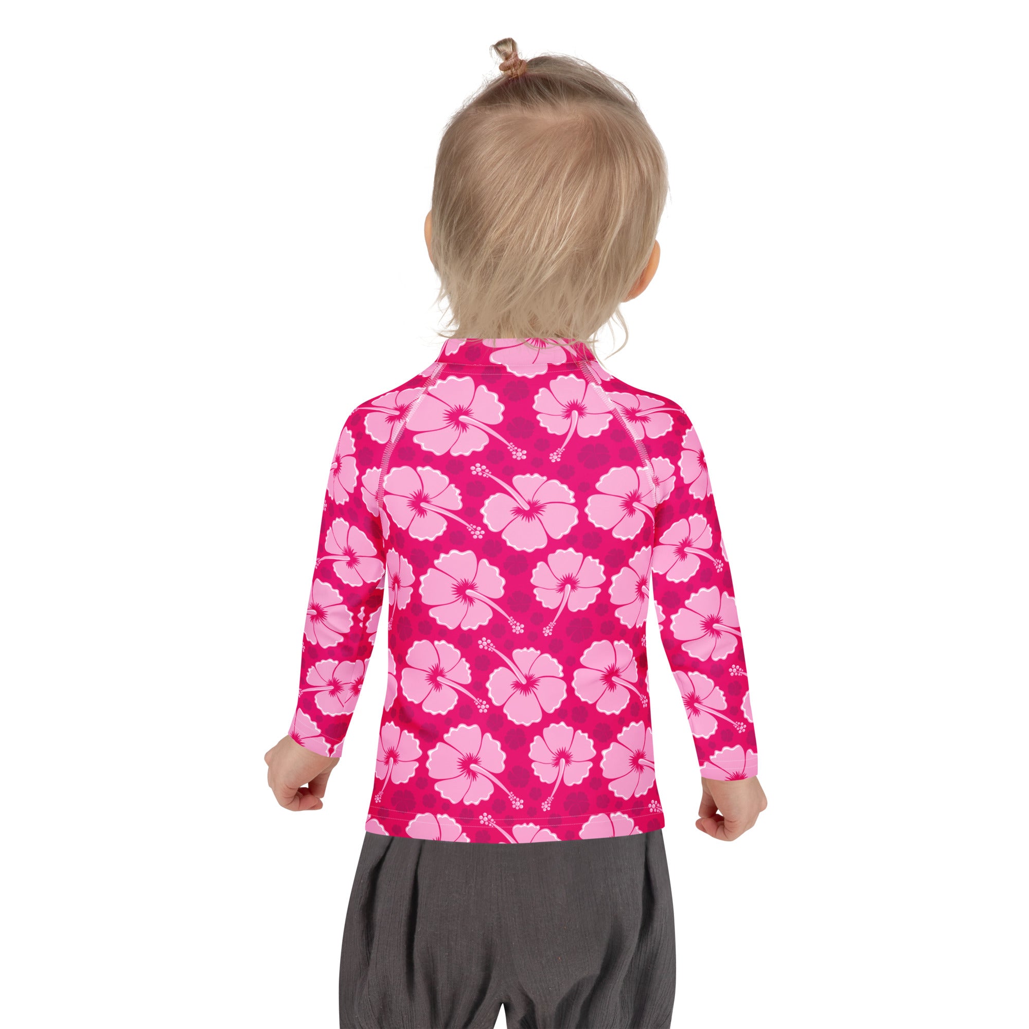 Girls tropical pink hibiscus long sleeve rash guard swim shirt with UPF 50 plus featuring light pink flower pattern
