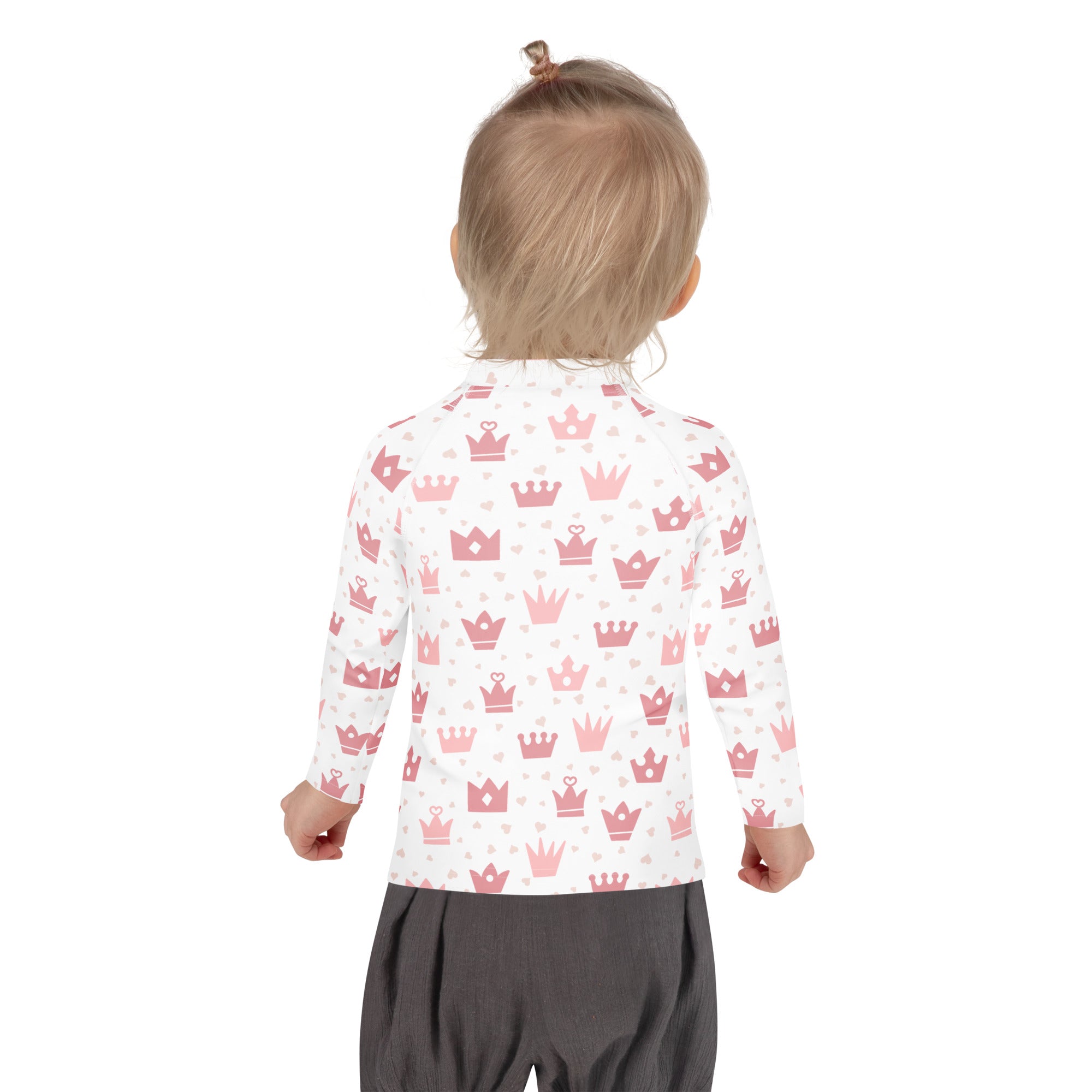 White long-sleeved girls princess crown rash guard swim shirt with upf 50 plus featuring pink crowns and hearts pattern