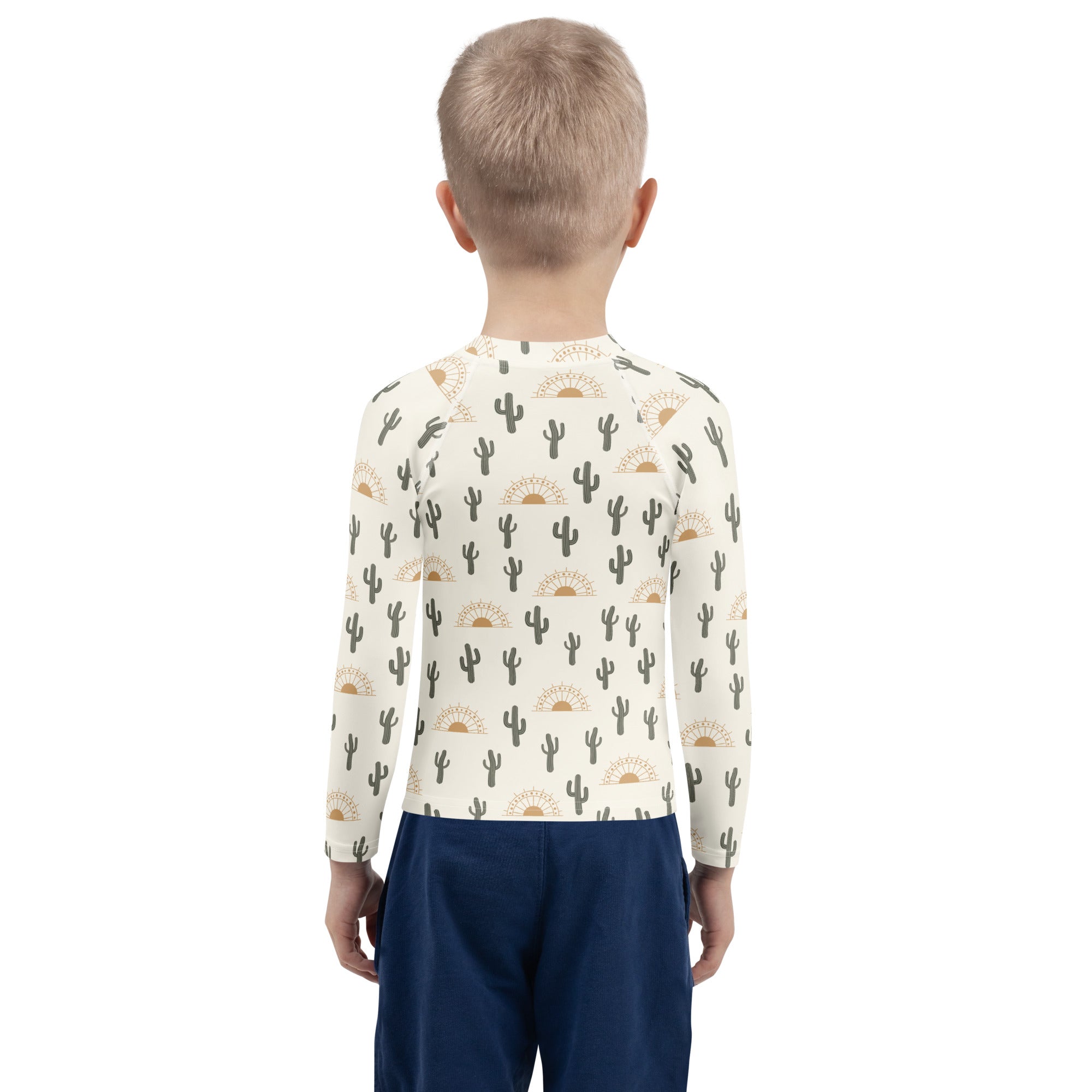 Kids cream-colored long sleeve rash guard swim shirt with black cacti gold suns pattern upf 50+ for sun protection