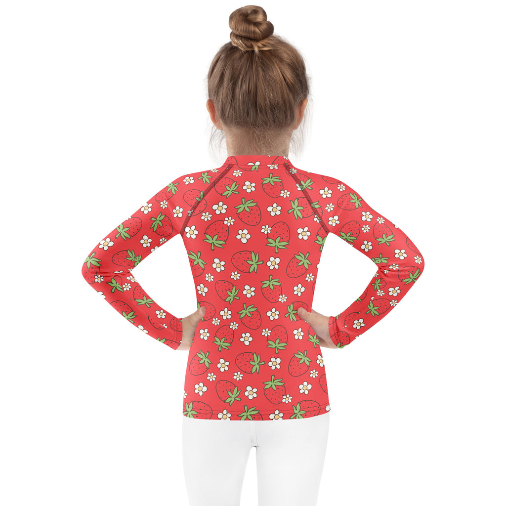 Kids red long sleeve rash guard swim shirt with playful strawberries and white flowers pattern and upf 50+ protection