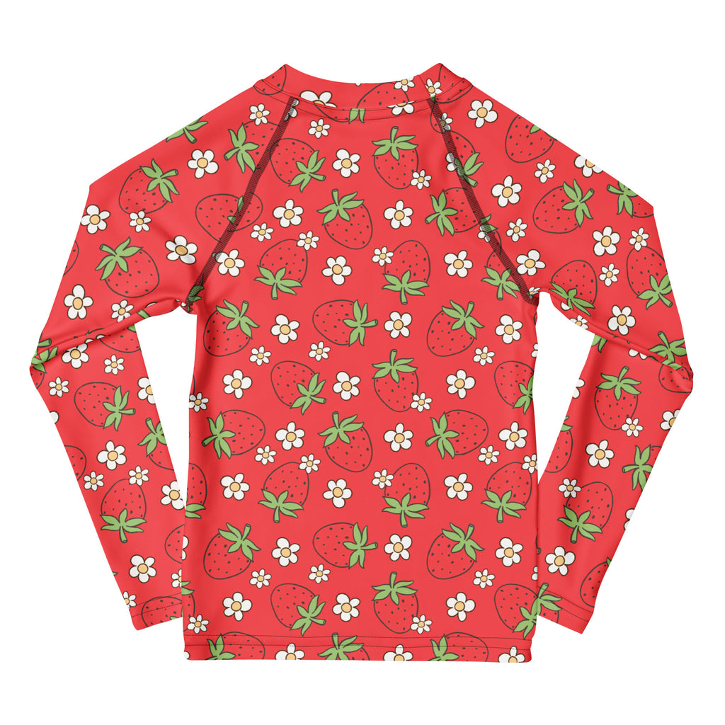 Kids red long sleeve rash guard swim shirt with playful cartoon strawberries and white flowers with upf 50 plus protection