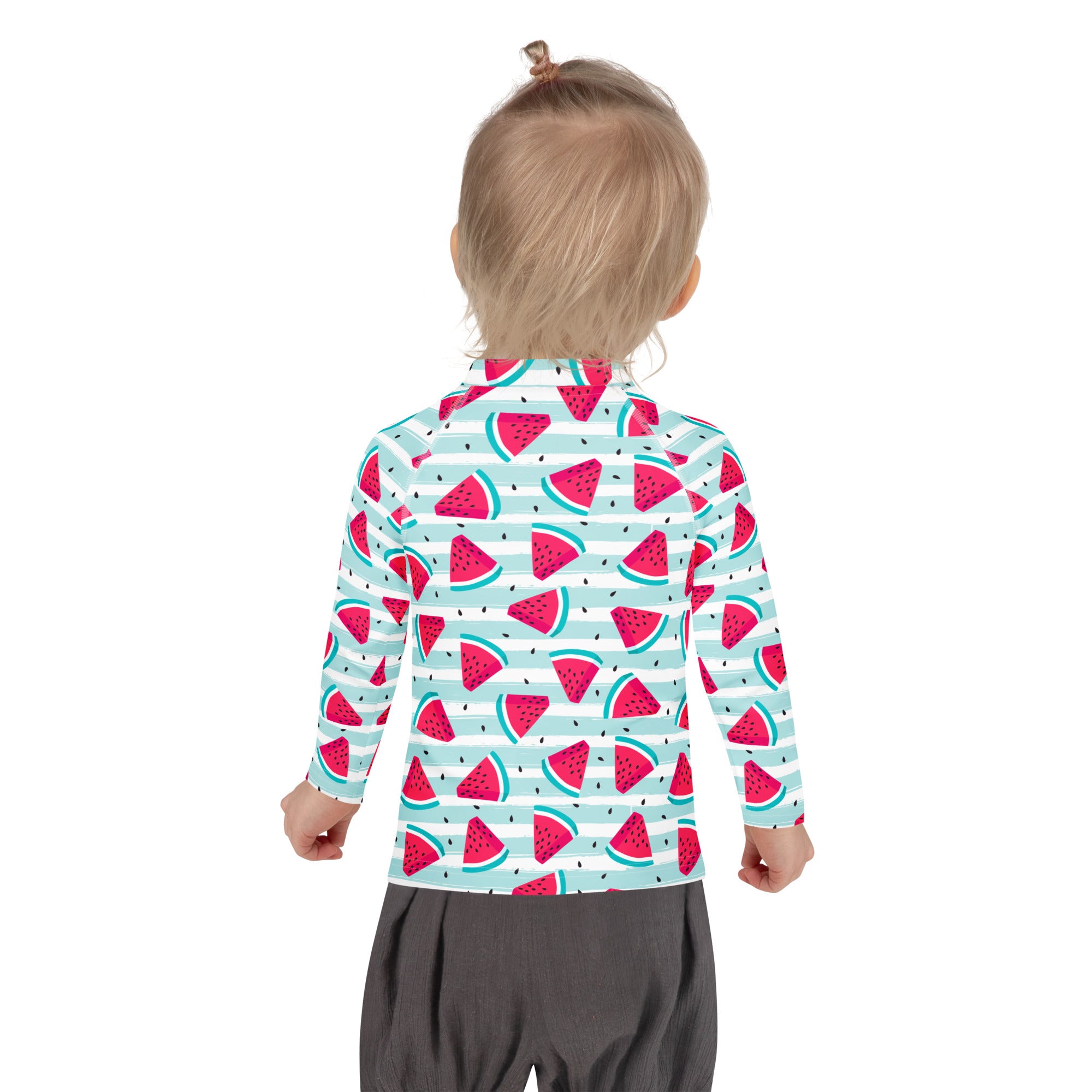 A child wearing a kids striped watermelon long sleeve rash guard swim shirt with upf 50 plus and playful pattern