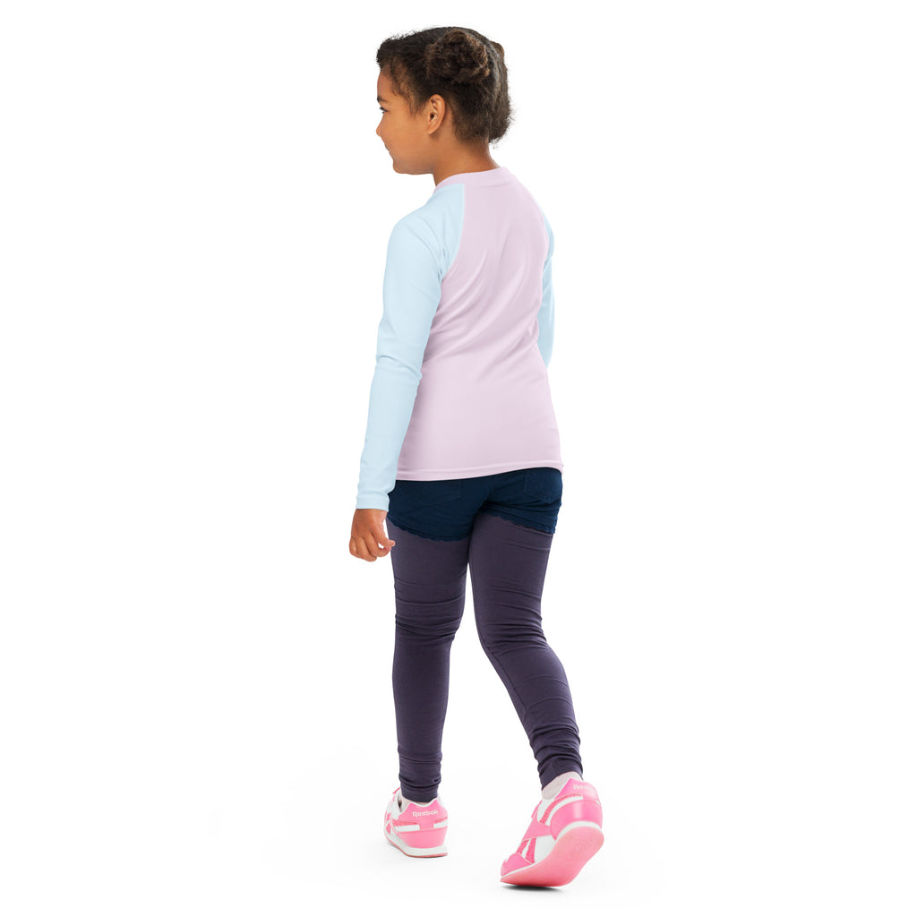 Girls pink and blue cotton candy long sleeve rash guard swim shirt with upf 50 plus paired with navy leggings and bright pink shoes