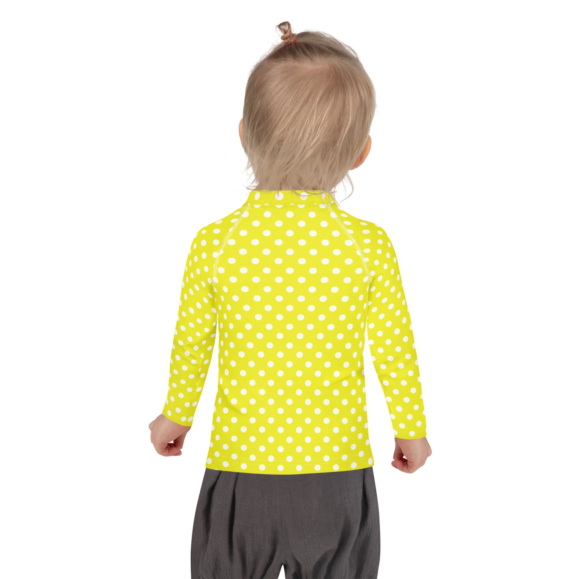 Kids yellow long sleeve rash guard swim shirt with white polka dots and UPF 50 plus sun protection