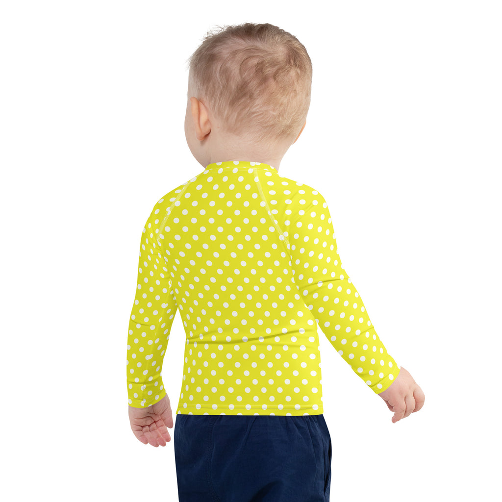 Kids yellow polka dots long sleeve rash guard swim shirt with upf 50 plus featuring bright yellow fabric and white dots