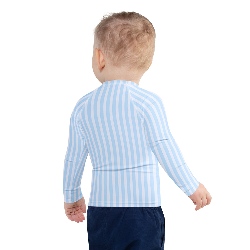 A child wearing a kids blue striped long sleeve rash guard swim shirt with UPF 50+ protection visible from the front