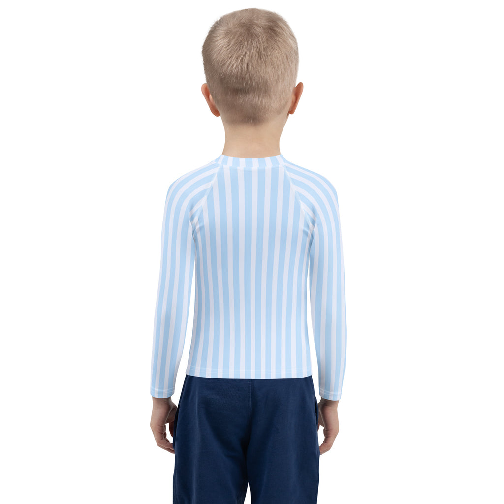 Kids blue striped long sleeve rash guard swim shirt with UPF 50 plus in light blue and white vertical stripes worn by child