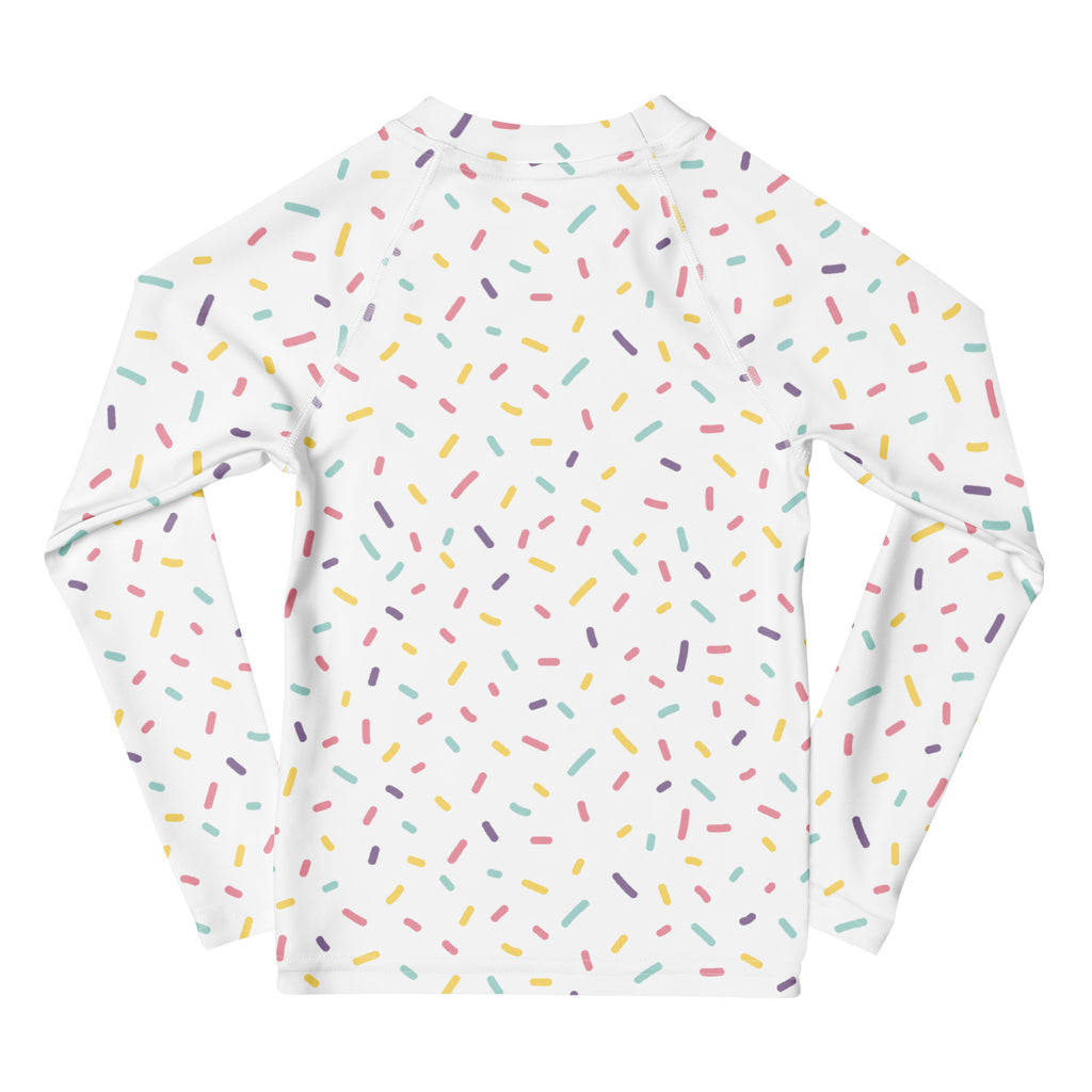 White long sleeve rash guard swim shirt with colorful pastel sprinkle pattern and UPF 50 plus sun protection for kids
