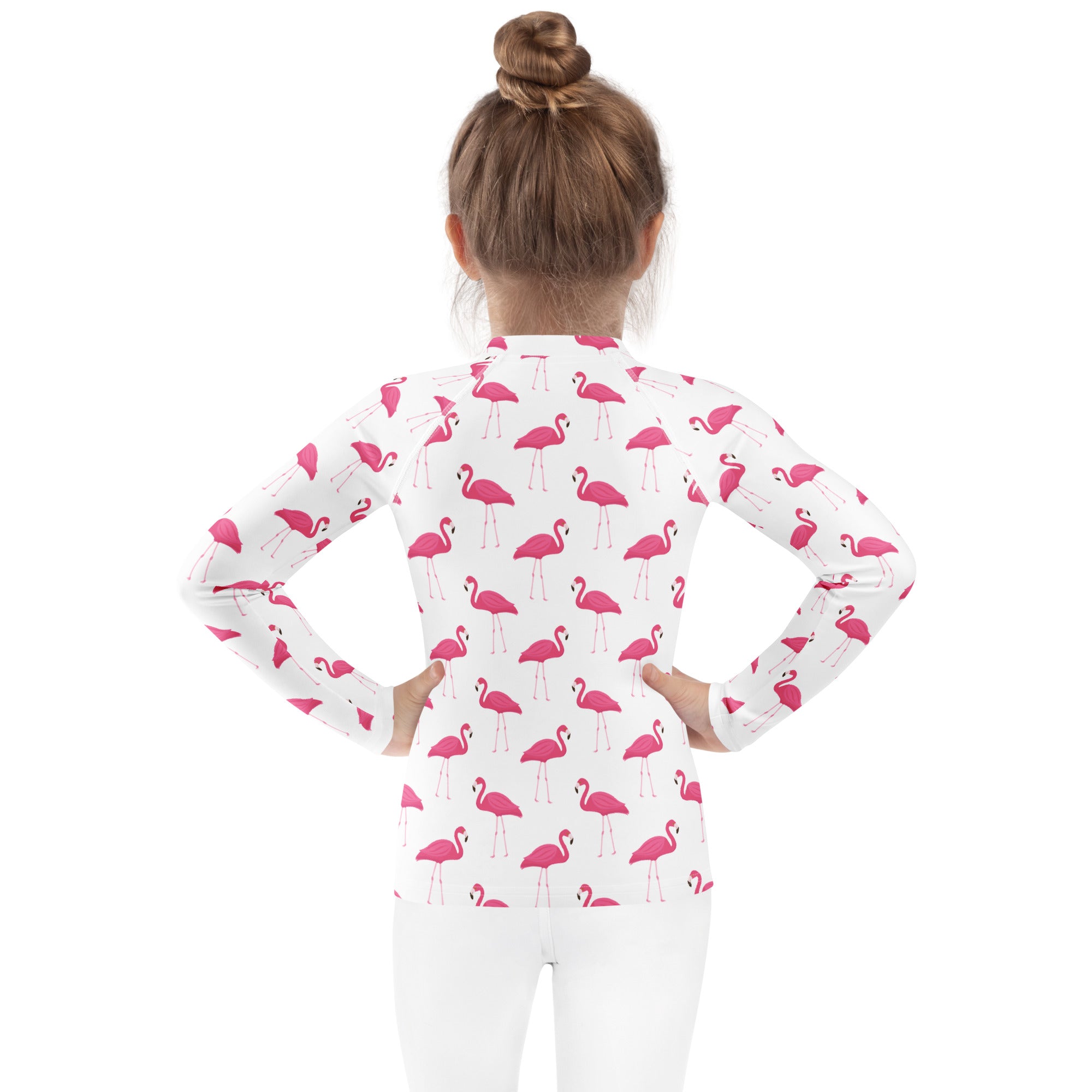 Kids pink flamingo long sleeve rash guard swim shirt in white with a pink flamingo pattern and upf 50 plus protection
