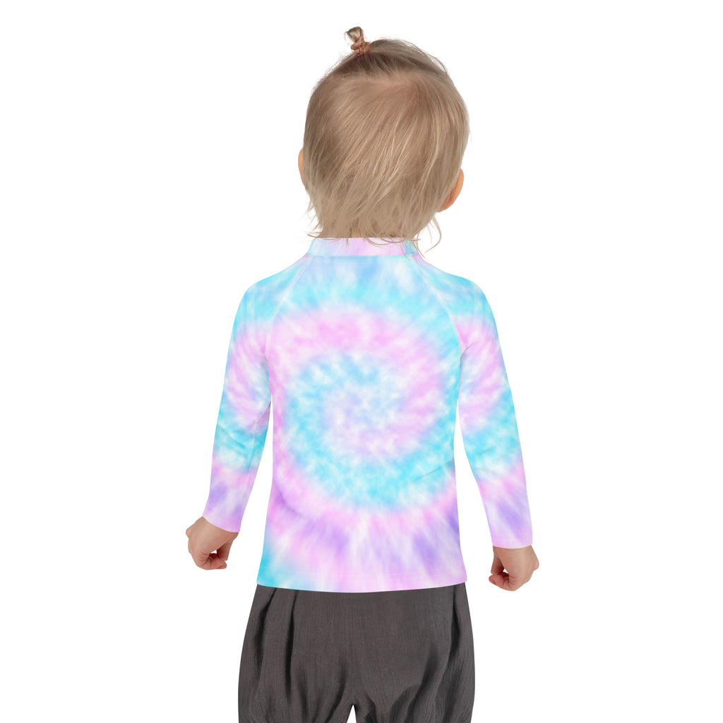 A child wearing a girl tie dye long sleeve rash guard swim shirt with upf 50 plus in blue pink and purple pastel shades