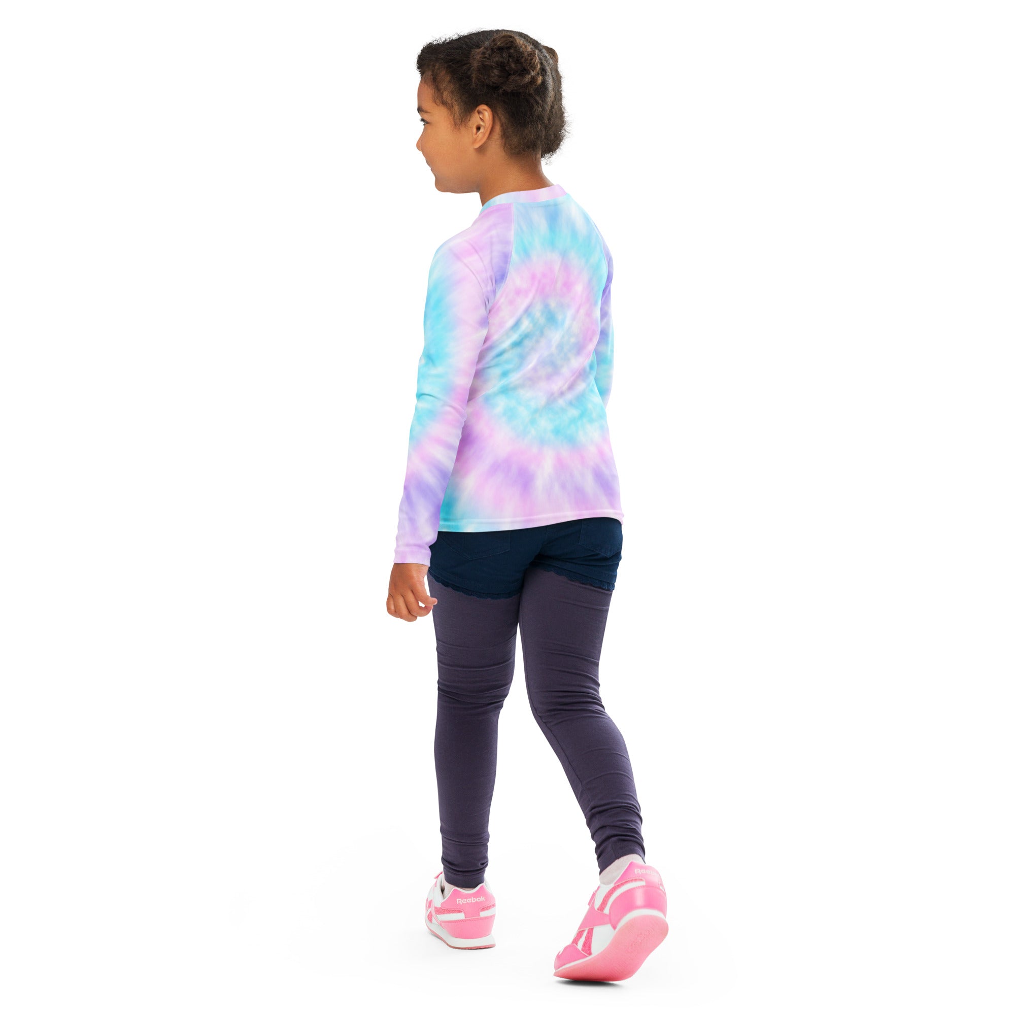 A child wearing a girl tie dye long sleeve rash guard swim shirt with upf 50 plus in light blue lavender and pink swirl patterns