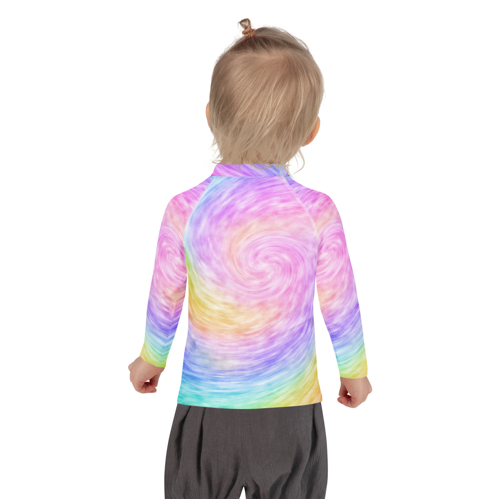 A child wearing a soft fabric kids rainbow tie dye long sleeve rash guard swim shirt with UPF 50 plus protection