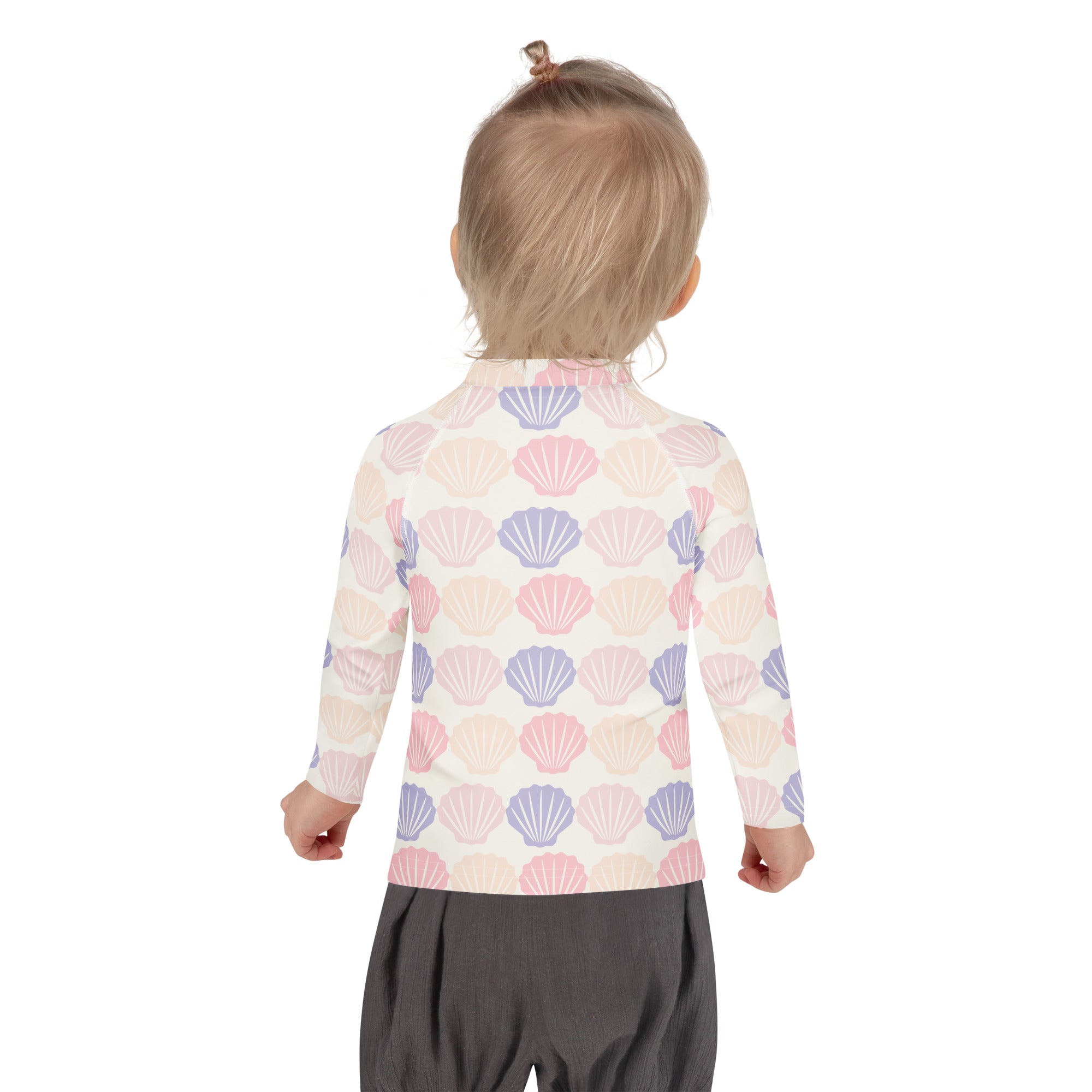 Kids seashell print long sleeve rash guard swim shirt with upf 50plus featuring pastel pink lavender and cream seashells