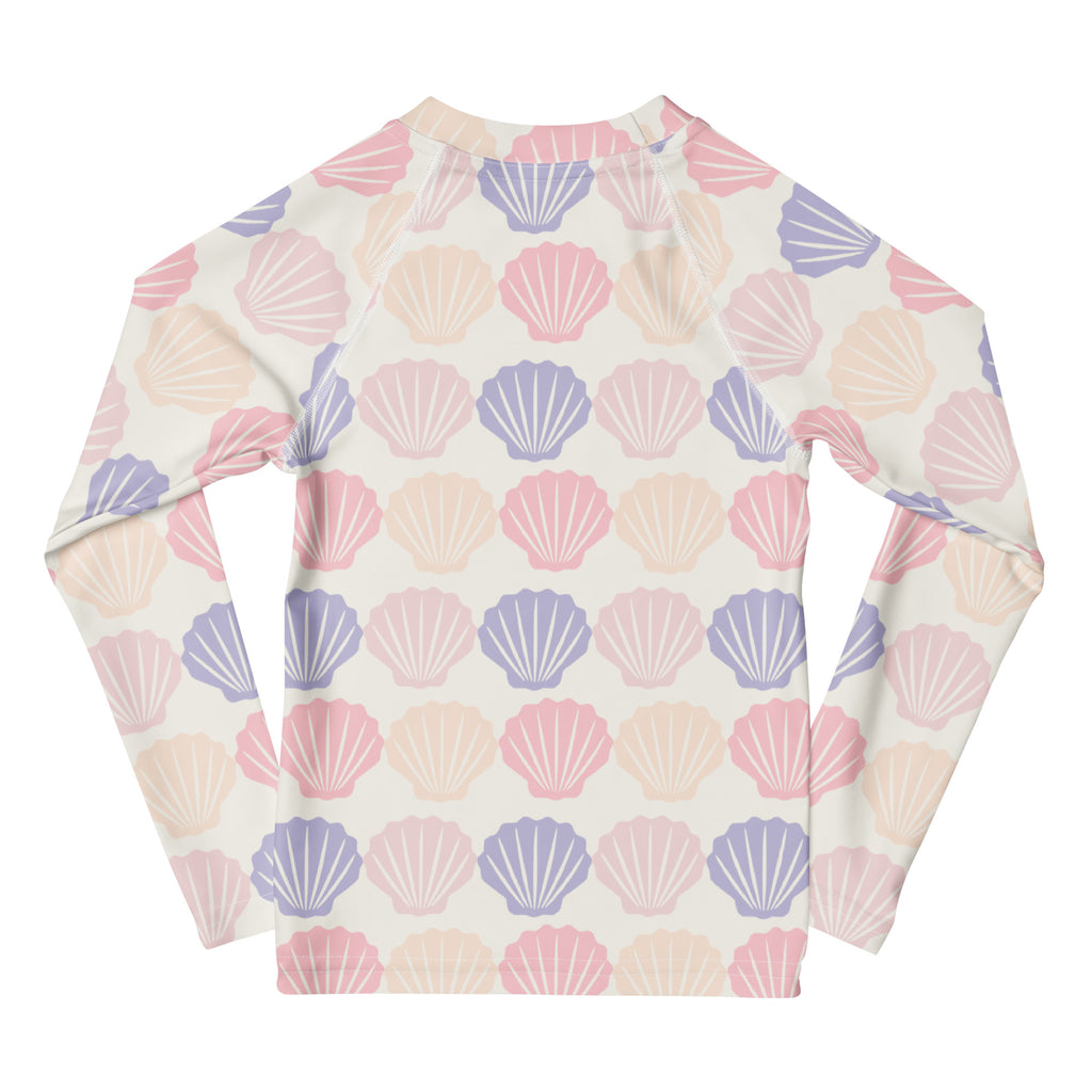 Kids seashell print long sleeve rash guard swim shirt with upf 50+ featuring pastel pink lavender and cream seashells on off-white