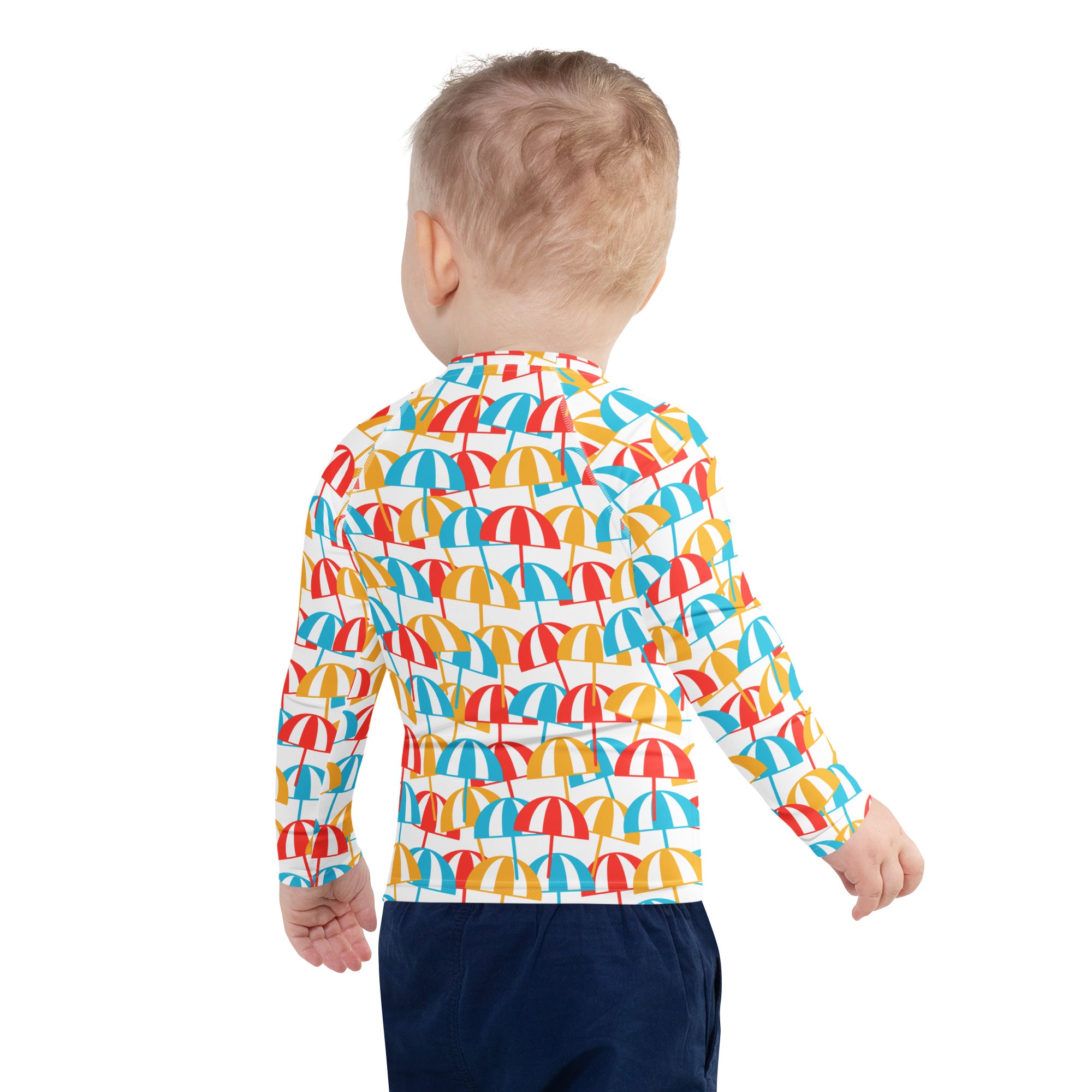 Kids beach umbrella long sleeve rash guard swim shirt with vibrant red yellow and blue umbrella pattern on white background