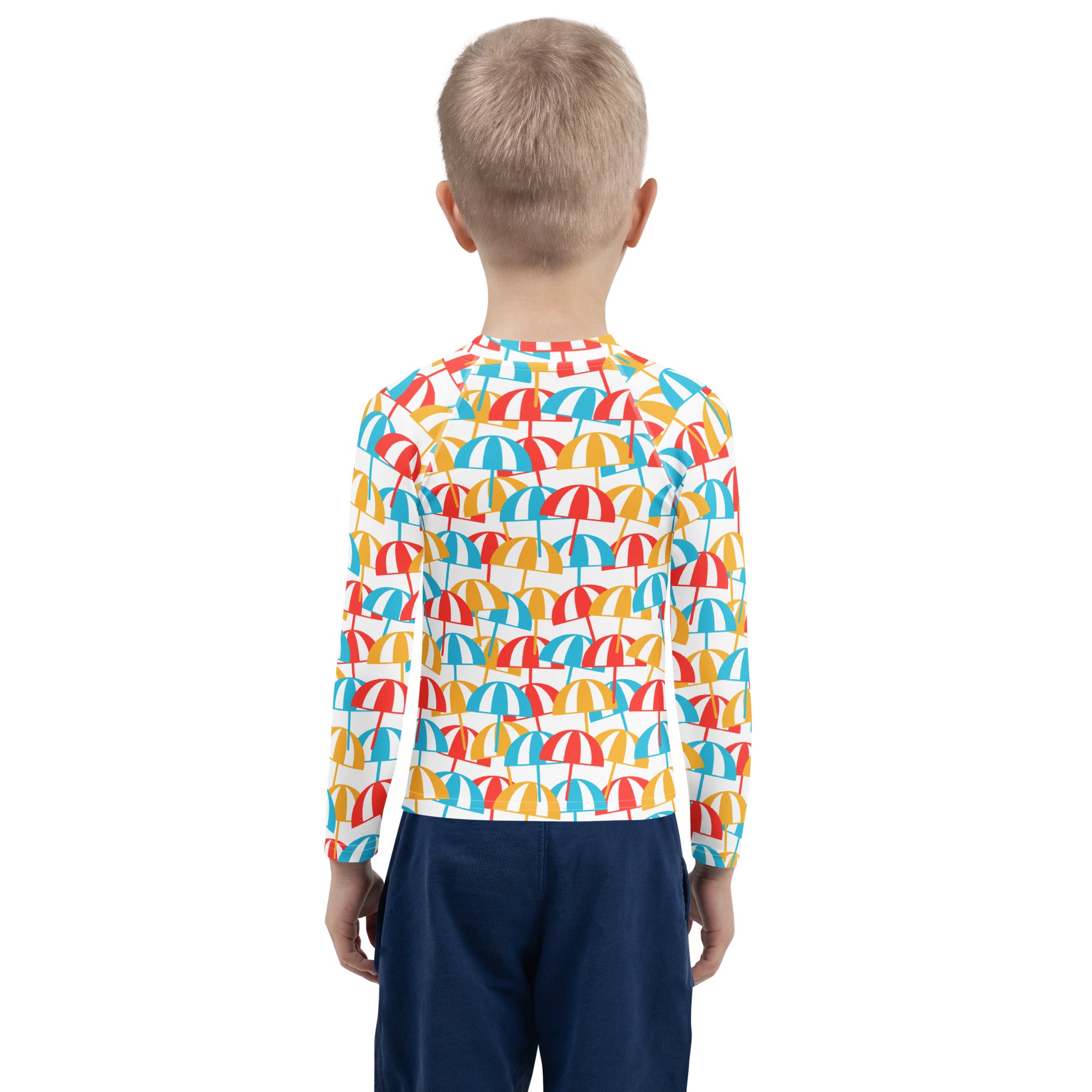 A child wearing a kids beach umbrella long sleeve rash guard swim shirt with upf 50 and colorful umbrella pattern