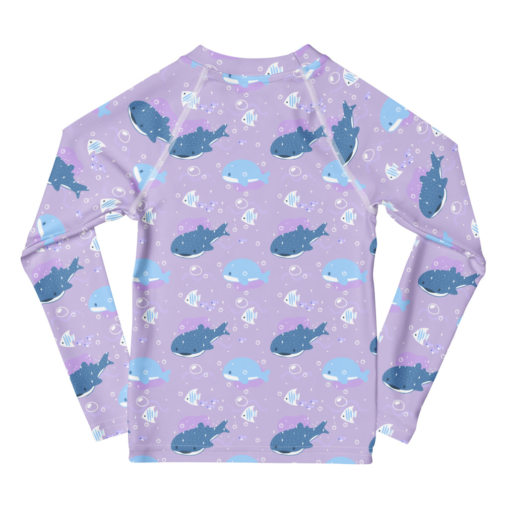 Girls purple long sleeve rash guard swim shirt with UPF 50 plus featuring blue whales fish and white bubbles pattern
