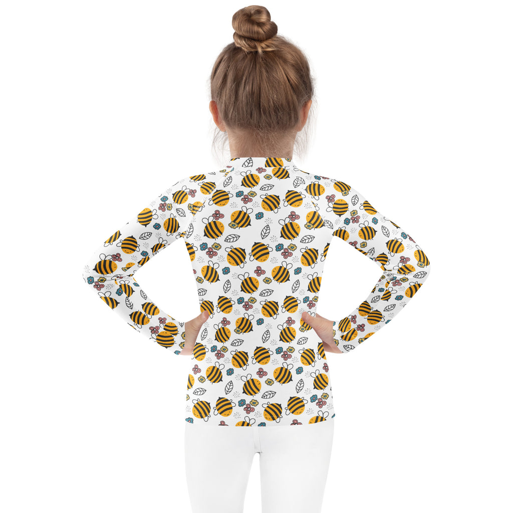 White kids long sleeve rash guard swim shirt with yellow bumblebee floral pattern and upf 50 plus sun protection