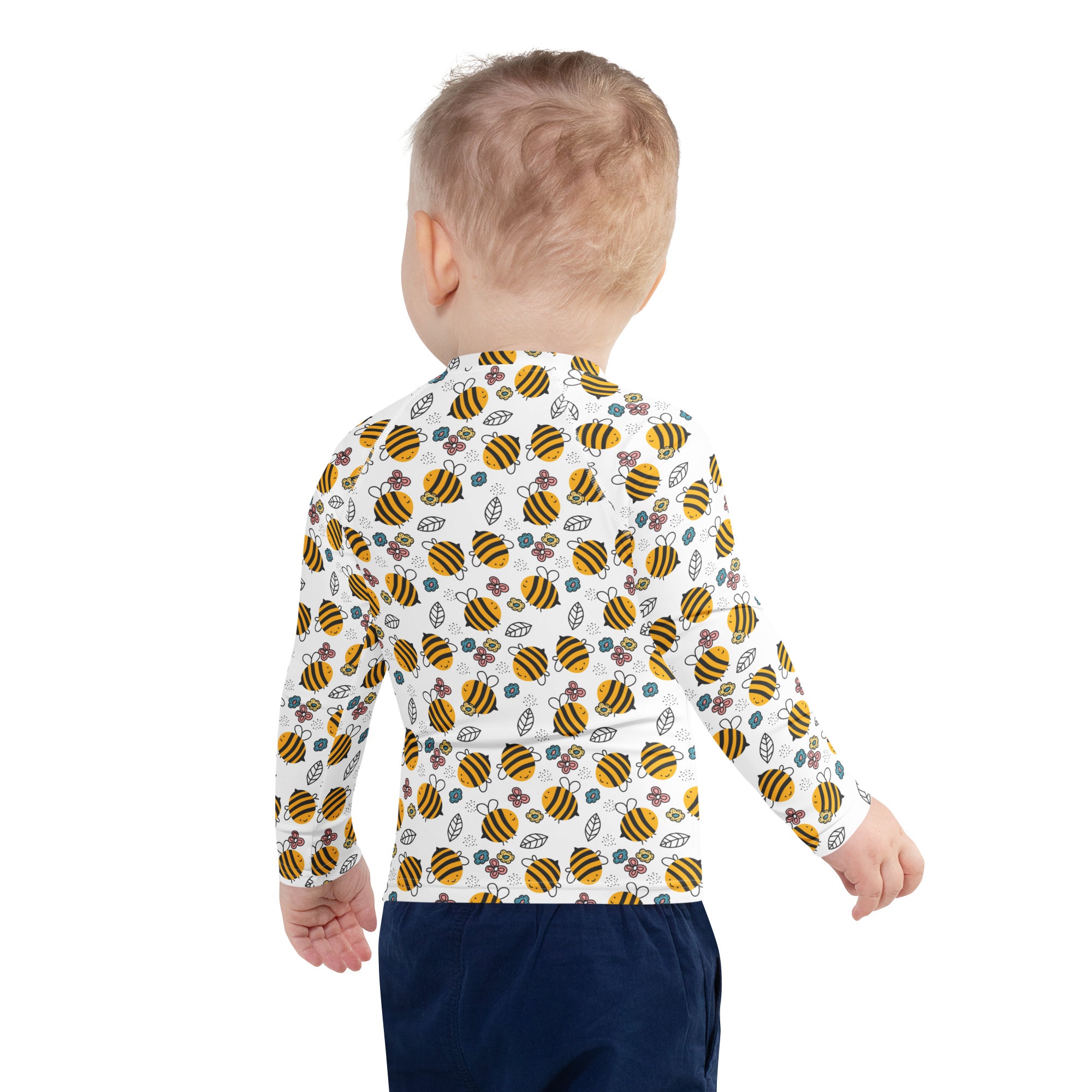 White long-sleeved kids rash guard with yellow and black bees floral pattern and upf 50 plus sun protection