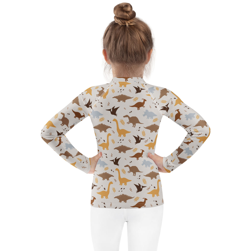 Kids dinosaur long sleeve rash guard swim shirt with upf 50 featuring a playful dinosaur pattern in earthy tones