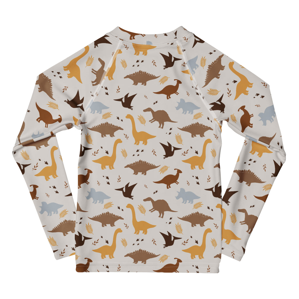 Kids dinosaur long sleeve rash guard swim shirt with upf 50 plus in off white with earthy dinosaur pattern