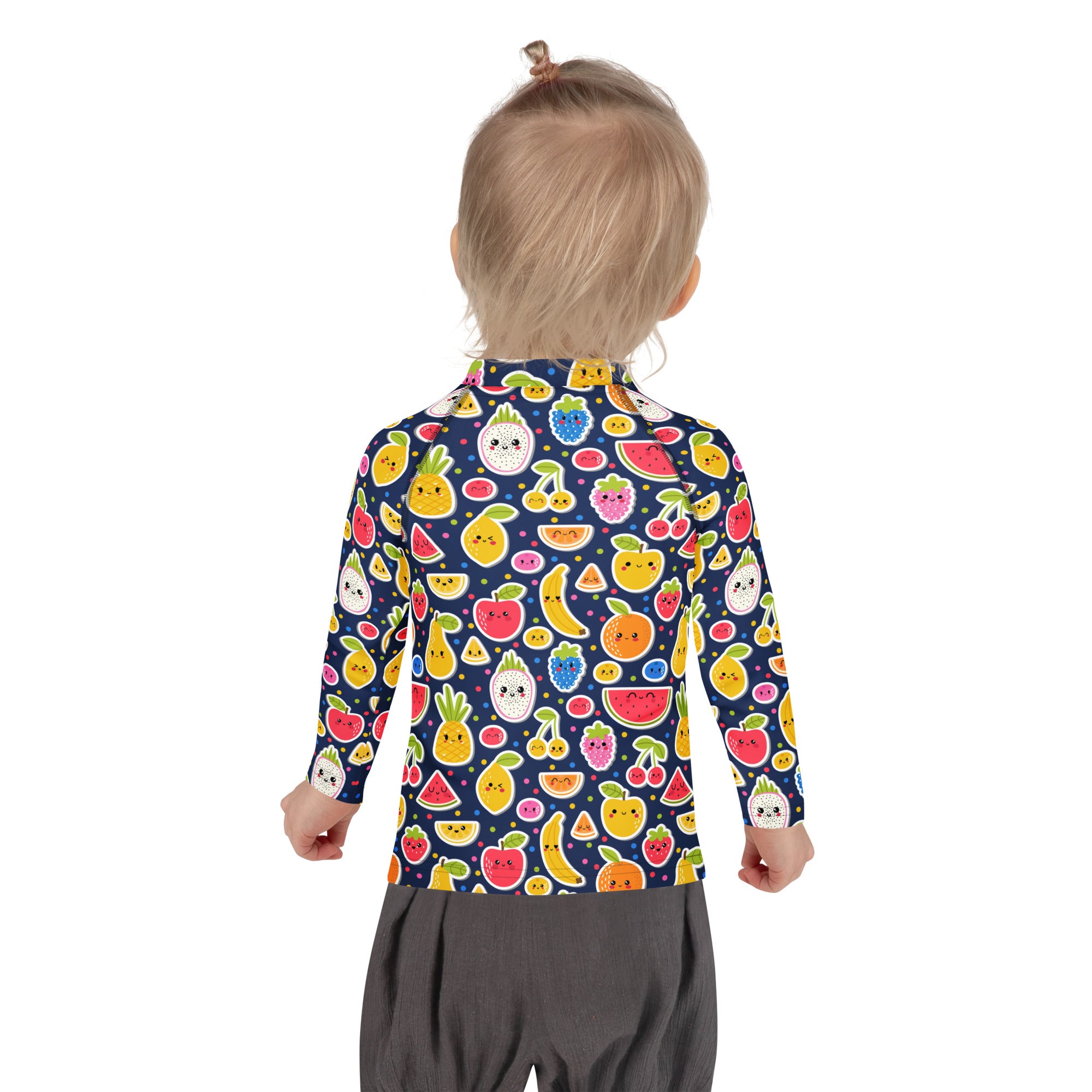 A child wearing a navy blue kids emoji fruit long sleeve rash guard swim shirt with colorful cartoon fruits and UPF 50+ protection