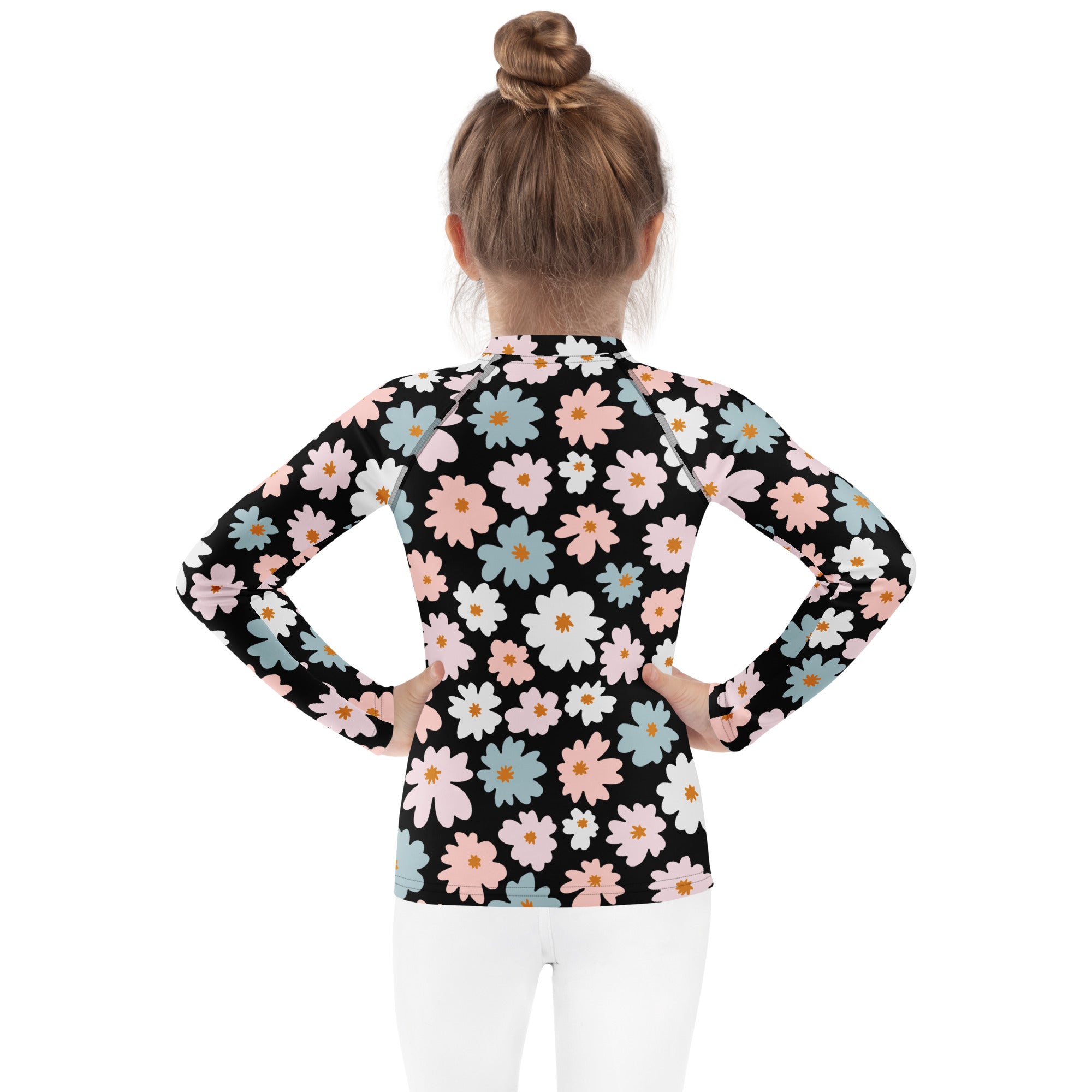 Black long-sleeved rash guard with pink white and blue daisies featuring upf 50 plus for girls swimwear