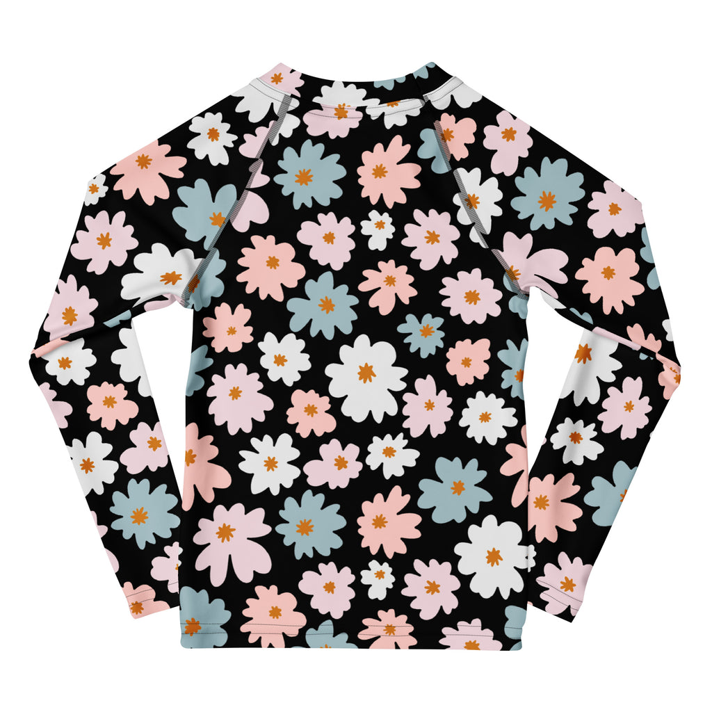 Black girls long sleeve rash guard with vibrant pink white and blue flower pattern and UPF 50 plus sun protection