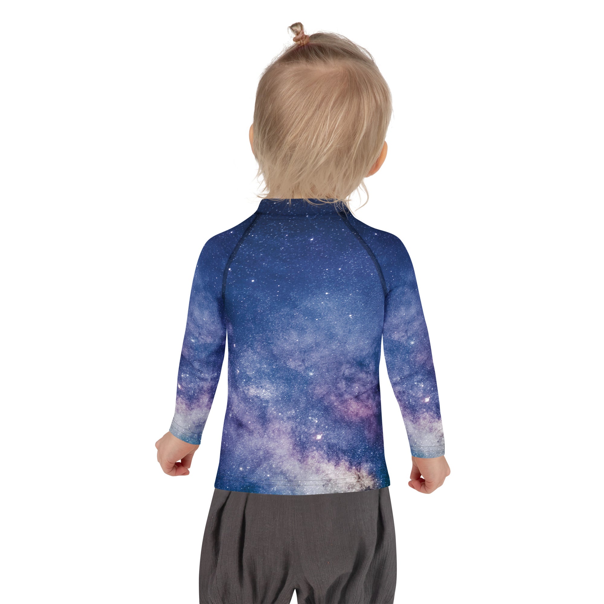 A child wearing a kids realistic galaxy long sleeve rash guard swim shirt in blue and purple with upf 50 plus protection