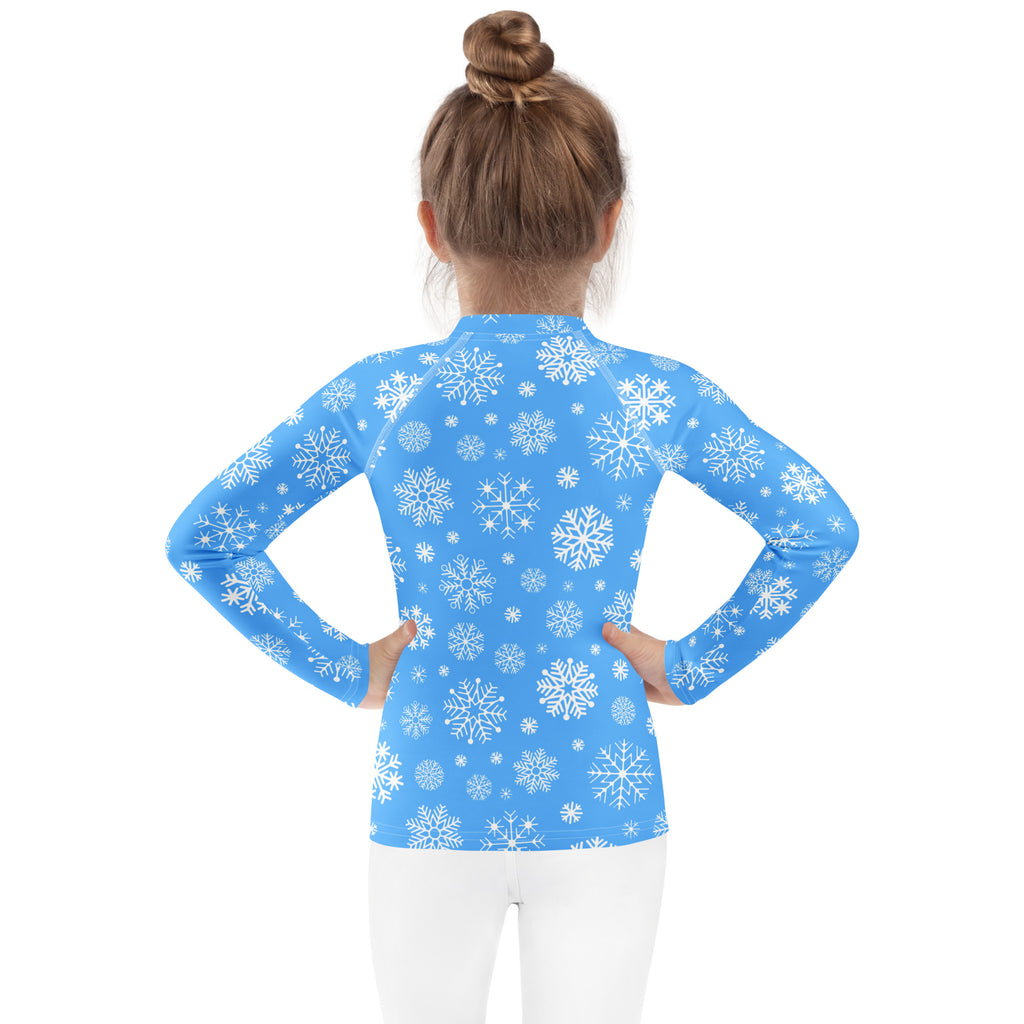 Kids blue long sleeve rash guard swim shirt with white snowflake pattern and UPF 50 plus sun protection