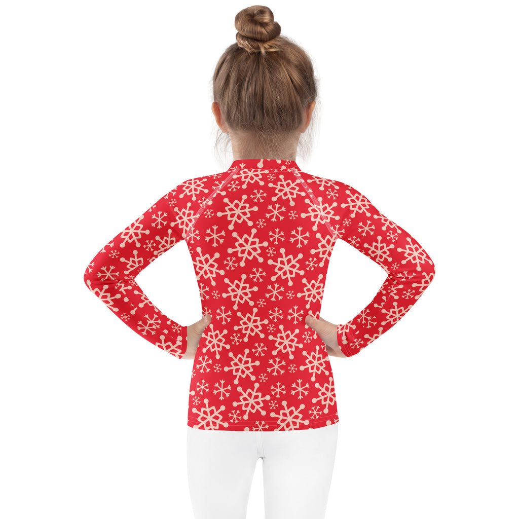 Kids red long sleeve rash guard swim shirt with white snowflake pattern and upf 50 plus for winter swim use